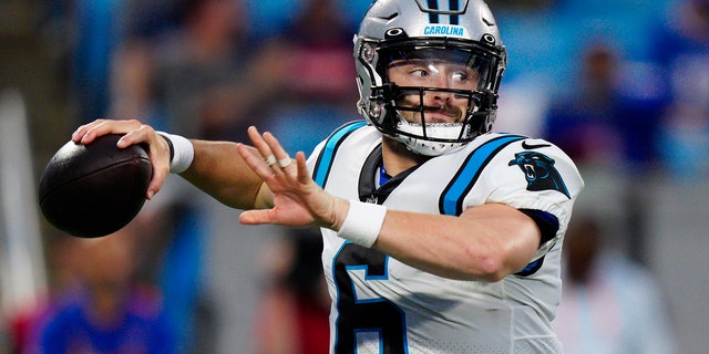 Carolina Panthers quarterback Baker Mayfield passes against the Buffalo Bills during the first half of a preseason game in Charlotte, North Carolina, on Aug. 26, 2022.