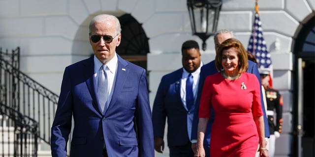 President Biden, CEO of SparkCharge Joshua Aviv and Speaker of the House Nancy Pelosi, D-Calif., arrive for a signing ceremony for the CHIPS and Science Act of 2022 on the South Lawn of the White House on Aug. 9, 2022, in Washington, DC.