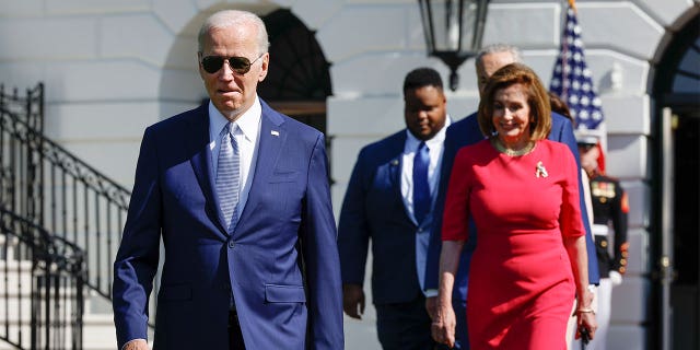 President Biden, CEO of SparkCharge Joshua Aviv and Speaker of the House Nancy Pelosi, D-Calif., arrive for a signing ceremony for the CHIPS and Science Act of 2022 on the South Lawn of the White House on Aug. 9, 2022, in Washington, DC.