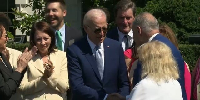 President Biden shook hands with Senate Majority Leader Chuck Schumer after signing the CHIPS bill, Tuesday, Aug. 9, 2022.