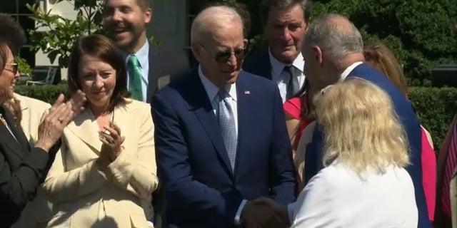 President Biden shook hands with Senate Majority Leader Chuck Schumer after signing the CHIPS bill, Tuesday, Aug. 9, 2022.