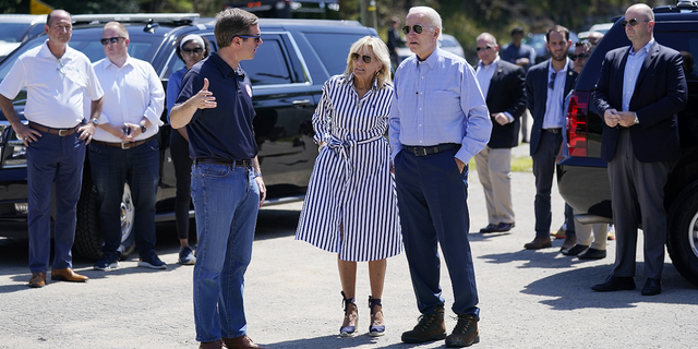 President Joe Biden and first lady Jill Biden talk with Kentucky Gov. Andy Beshear while they view flood damage in Lost Creek, Ky., on Monday, Aug. 8.