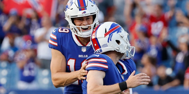 Buffalo Bills punter Matt Araiza, links, celebrates with place-kicker Tyler Bass after Bass kicked the go-ahead field goal against the Indianapolis Colts on Saturday, Aug.. 13, 2022, in Orchard Park, New York.