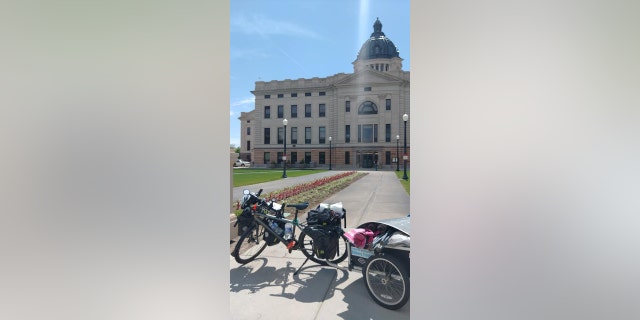Barnes' bike is pictured in front of the capitol building in Pierre, South Dakota — the state he calls the friendliest of all.