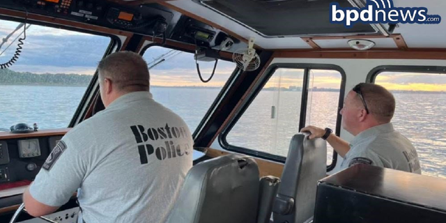 The Boston Police Department's Harbor Patrol Unit is seen transporting the groom and others to the ceremony on Saturday, Aug. 13, on Thompson Island.