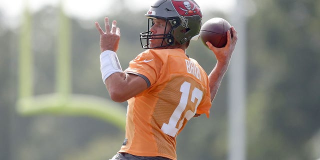 Tom Brady throws a pass during practice on Aug. 10, 2022, at the AdventHealth Training Center at One Buccaneer Place in Tampa, Florida.
