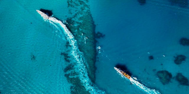 An Allen Exploration fleet is shown in the waters of the Bahamas.
