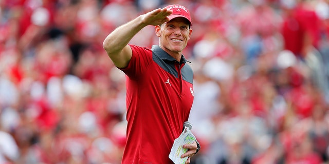 Head coach Brent Venables of the Oklahoma Sooners jokingly asks the crowd if they think the first half performance was a 'B-' during the spring game at Gaylord Family Oklahoma Memorial Stadium on April 23, 2022 in Norman, Oklahoma.