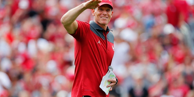 Head coach Brent Venables of the Oklahoma Sooners jokingly asks the crowd if they think the first half performance was a 'B-' during the spring game at Gaylord Family Oklahoma Memorial Stadium on April 23, 2022 in Norman, Oklahoma.