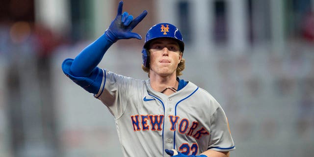 New York Mets' Brett Beatty gestures after hitting a two-run home run against the Atlanta Braves in Atlanta, Wednesday, Aug. 17, 2022.