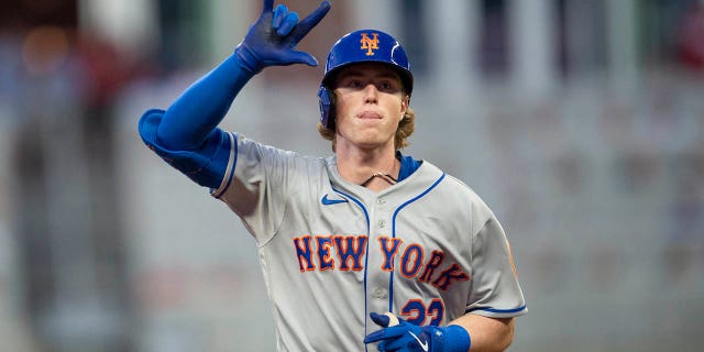 New York Mets' Brett Beatty gestures after hitting a two-run home run against the Atlanta Braves in Atlanta, Wednesday, Aug. 17, 2022.