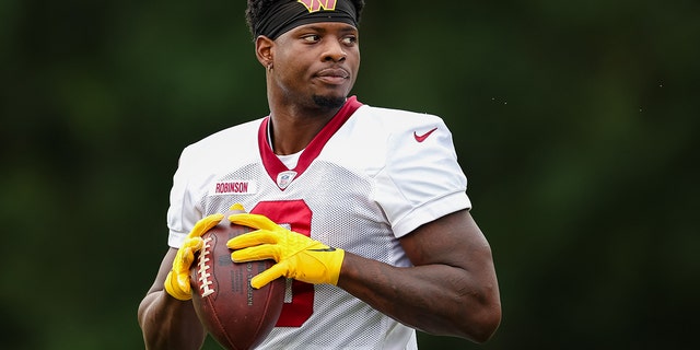 Brian Robinson, #8 of the Washington Commanders, participates in a drill during training camp at INOVA Sports Performance Center on August 17, 2022 in Ashburn, Virginia.