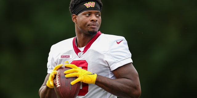 Brian Robinson of the Washington Commanders participates in a drill during training camp at Inova Sports Performance Center in Ashburn, Virginia, on Aug. 17, 2022.