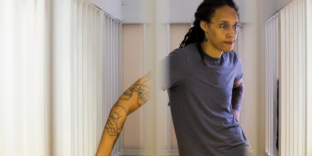 WNBA star and two-time Olympic gold medalist Brittney Griner stands in the defendant's cage in a courtroom in Khimki, Russia, outside Moscow, on August 4, 2022.