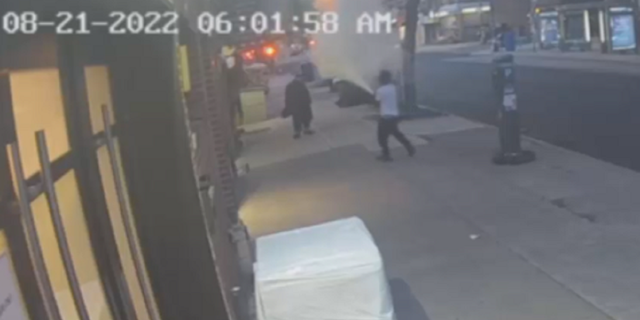The suspect is then seen spraying powder from a fire extinguisher on the victim.