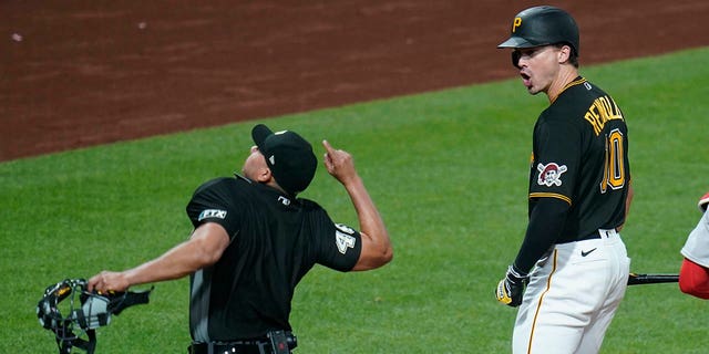 Home plate umpire Roberto Ortiz, left, ejects Pittsburgh Pirates' Brian Reynolds, 10, for claiming the third strike in the eighth inning against the Boston Red Sox on August 16, 2022 in Pittsburgh. .