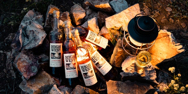Five bottles of Campfire seasonal whiskey from High West Distillery replace a campfire.