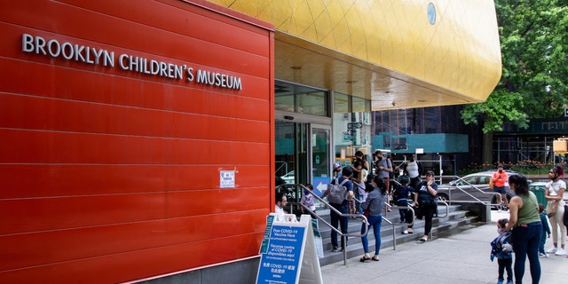 Children line up to receive the Covid-19 vaccine for children aged 6 months to 5 years at the Immunization Site at the Children's Museum of Brooklyn in Brooklyn, New York, Thursday, June 23, 2022. 