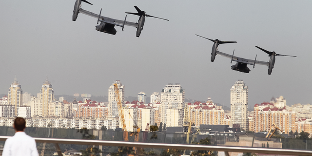 Two CV-22 Osprey tiltrotor military aircraft of the U.S. Air Force fly over Kyiv, Ukraine, during air drills in March 2020.