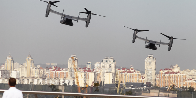 Two CV-22 Osprey tiltrotor military aircraft of the U.S. Air Force fly over Kyiv, Ukraine, during air drills in March 2020.