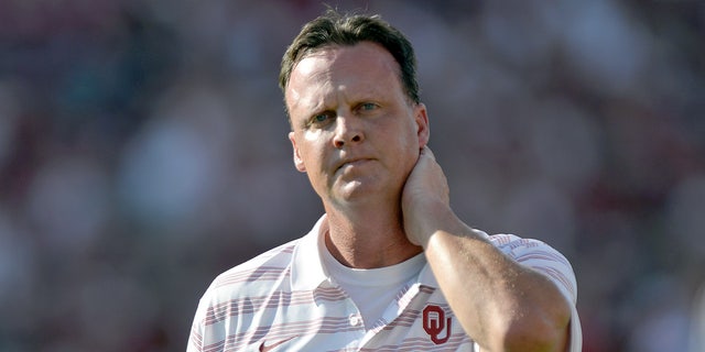 Running backs coach Cale Gundy of the Oklahoma Sooners walks the field prior to kickoff of their game against the Louisiana Tech Bulldogs at Gaylord Family Oklahoma Memorial Stadium on August 30, 2014 in Norman, Oklahoma.