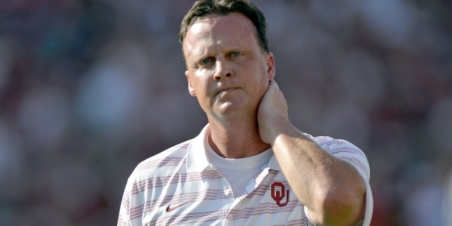 Oklahoma Sooners running backs coach Cale Gundy walks on the field before the kickoff of their game against the Louisiana Tech Bulldogs at Gaylord Family Oklahoma Memorial Stadium on August 30, 2014 in Norman, Oklahoma.