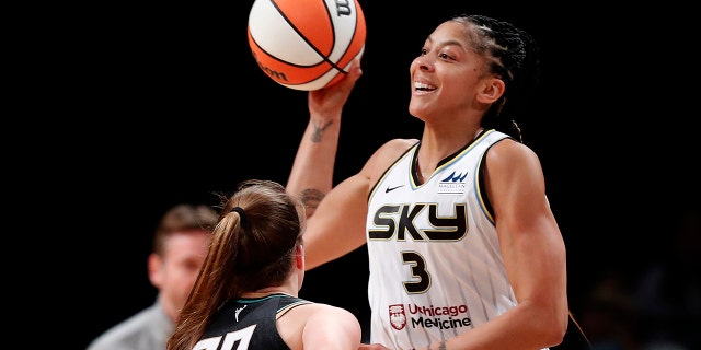 Chicago Sky forward Candace Parker (3) passes the ball over the head of New York Liberty guard Sabrina Ionescu (20) during the first half of a WNBA playoff game Aug. 23, 2022, in New York.