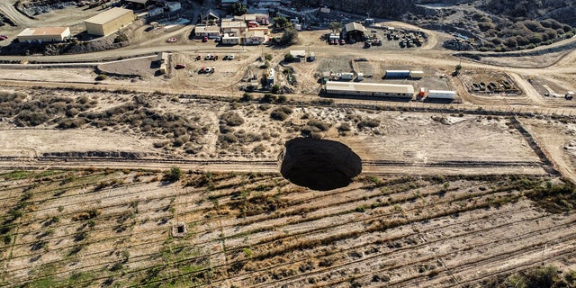 A 328-foot security perimeter has been erected around the hole near the Alcaparrosa mine operated by Canadian firm Lundin Mining.