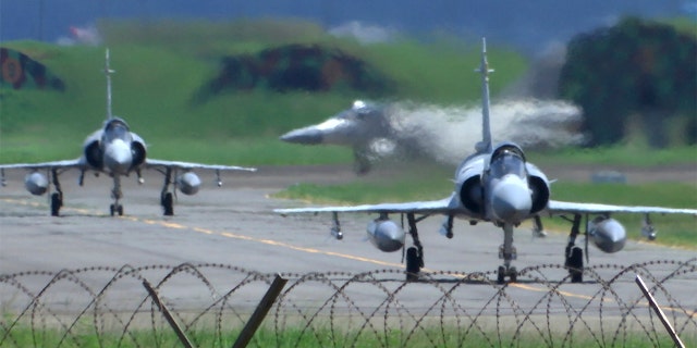 Taiwan Air Force Mirage fighter jets taxi on a runway at an airbase in Hsinchu, Taiwan, Friday, Aug. 5, 2022.