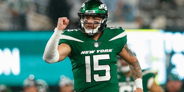 New York Jets quarterback Chris Streveler, #15, celebrates after tight end Lawrence Cager runs in a touchdown during the second half of an NFL football game against the Atlanta Falcons, Monday, Aug. 22, 2022, in East Rutherford, N.J.