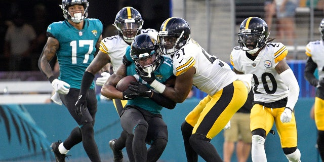 Pittsburgh Steelers linebacker Myles Jack (51) tackles Jacksonville Jaguars wide receiver Christian Kirk, center, during the first half of an NFL preseason football game, Saturday, Aug. 20, 2022, in Jacksonville, Fla.