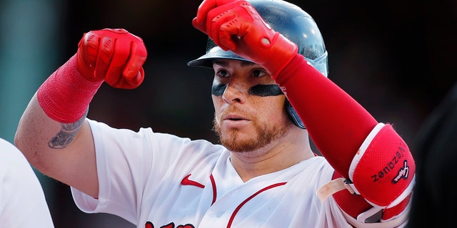 Boston Red Sox's Christian Vazquez gestures after hitting an RBI single during the seventh inning of the team's baseball game against the Milwaukee Brewers, Saturday, July 30, 2022, in Boston.