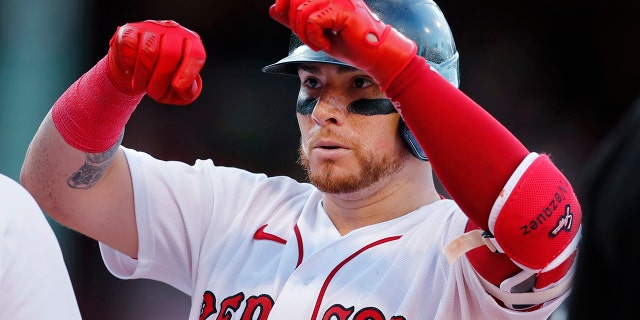 Boston Red Sox's Christian Vazquez gestures after hitting an RBI single during the seventh inning of the team's baseball game against the Milwaukee Brewers, Saturday, July 30, 2022, in Boston.