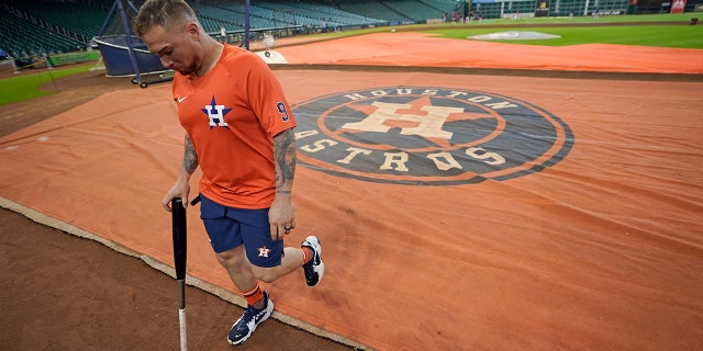 Houston Astros' Christian Vazquez walks toward the dugout before a game against the Boston Red Sox, Tuesday, Aug. 2, 2022, in Houston. Vazquez was traded from the Red Sox to the Astros on Monday.