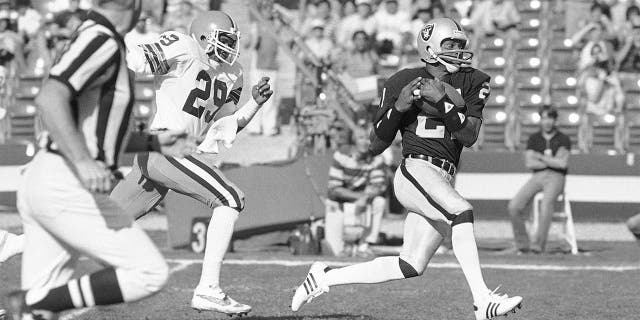 Los Angeles Raiders wide receiver Cliff Branch, right, catches a pass from quarterback Jim Plunkett for a 64-yard gain as Cleveland Browns' Hanford Dixon defends during the first quarter of an NFL football playoff game in Los Angeles, on Jan. 8, 1983. Branch was one of the best deep threats of his era to earn a spot in the Pro Football Hall of Fame.