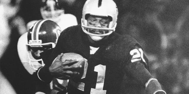 Oakland Raiders' Cliff Branch is brought down by Denver Broncos' Bob after picking up nine yards on a pass from quarterback Ken Stabler during the first period of an NFL football game on Dec. 3, 1978, at the Oakland Coliseum in Oakland, Calif. Branch was one of the best deep threats of his era to earn a spot in the Pro Football Hall of Fame.