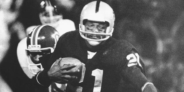 Oakland Raiders' Cliff Branch is brought down by Denver Broncos' Bob after picking up nine yards on a pass from quarterback Ken Stabler during the first period of an NFL football game on Dec. 3, 1978, at the Oakland Coliseum in Oakland, Calif. Branch was one of the best deep threats of his era to earn a spot in the Pro Football Hall of Fame. 