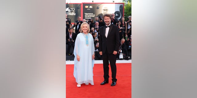 Hillary Clinton and Italian culture minister Dario Franceschini walked side by side at the Venice Film Festival. 