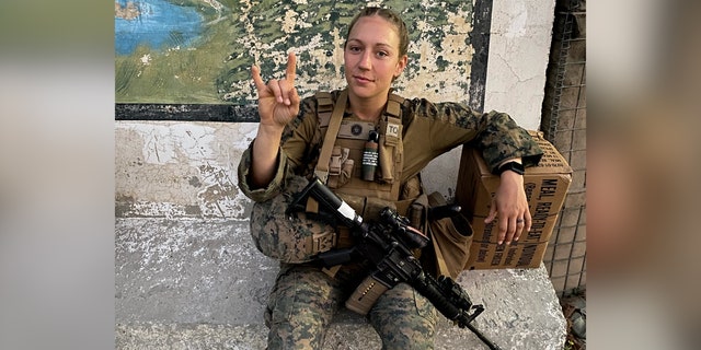Gee poses for the camera while in her Marine gear.