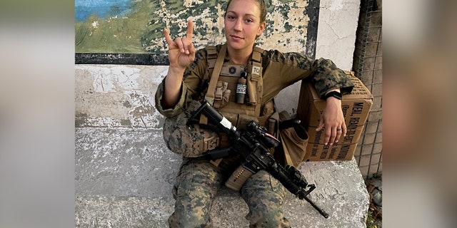 Gee poses for the camera while in her Marine gear.