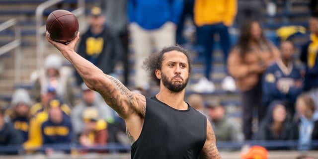 Colin Kaepernick participates in a pitching display during halftime of the Michigan spring football game at Michigan Stadium on April 2, 2022 in Ann Arbor, Michigan. 