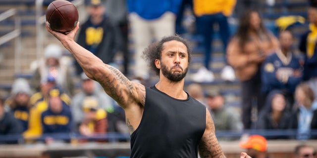 Colin Kaepernick attends a pitching exhibition during halftime of a Michigan Spring Football game at Michigan Stadium in Ann Arbor, Michigan on April 2, 2022. 