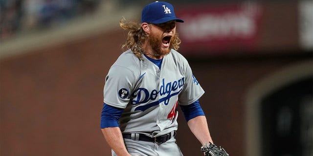 Los Angeles Dodgers pitcher Craig Kimbrel reacts after striking out San Francisco Giants' Austin Slater to end the baseball game in San Francisco, Wednesday, Aug. 3, 2022. 