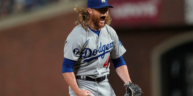 Los Angeles Dodgers pitcher Craig Kimbrel reacts after striking out San Francisco Giants' Austin Slater to end the baseball game in San Francisco, Wednesday, Aug. 3, 2022.