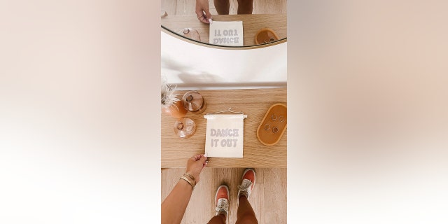 Imani Collective has handcrafted signs and banners to design a dorm room.