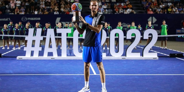 Daniel Medvedev of Russia celebrates with the trophy after winning his match against Cameron Norrie of Great Britain after the final match of the Miffel ATP Los Cabos Open 2022 at the Cabo Sports Complex on August 06, 2022 in San Jose del Cabo, Mexico.