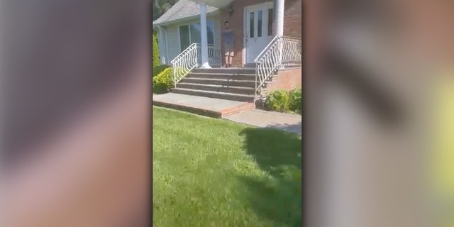 Video shows the father, Devon Tyme, walking up his own driveway to find an agitated man on his front porch.