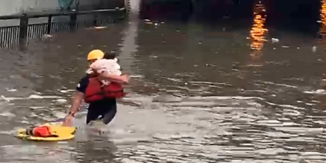 An infant also was among those who had to be rescued after becoming trapped in the vehicle.