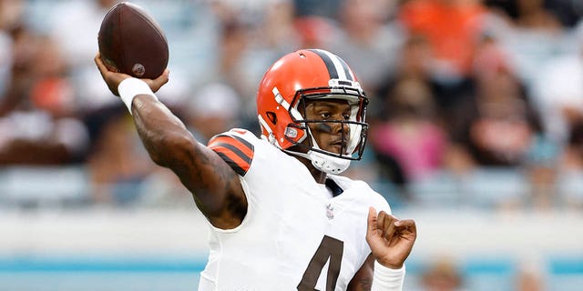 Cleveland Browns quarterback Deshaun Watson looks to throw during the first quarter of a preseason game against the Jacksonville Jaguars at TIAA Bank Field in Jacksonville, Fla., Aug. 12, 2022.