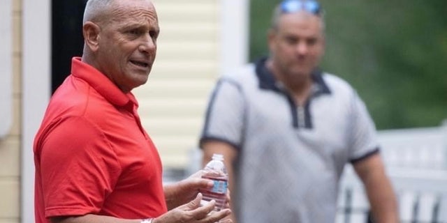 Retired Army Gen. Don Bolduc, who's making a second straight run for the GOP Senate nomination, speaks with voters at a campaign event in Epping, New Hampshire, on July 16, 2022.